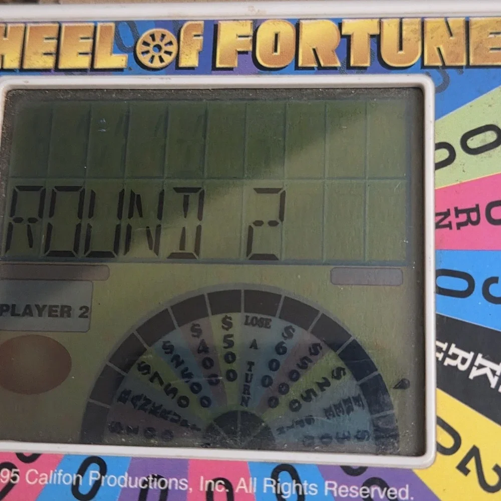 Vintage Wheel of Fortune Handheld Electronic Game Cartridges Tiger 1995 - TESTED
